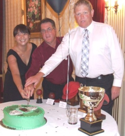 *Cutting the cake: L-R Tien Polonidis, who designed it; MVCC founder Ray Storey, and our first 300 gamer, Darren Nagle.